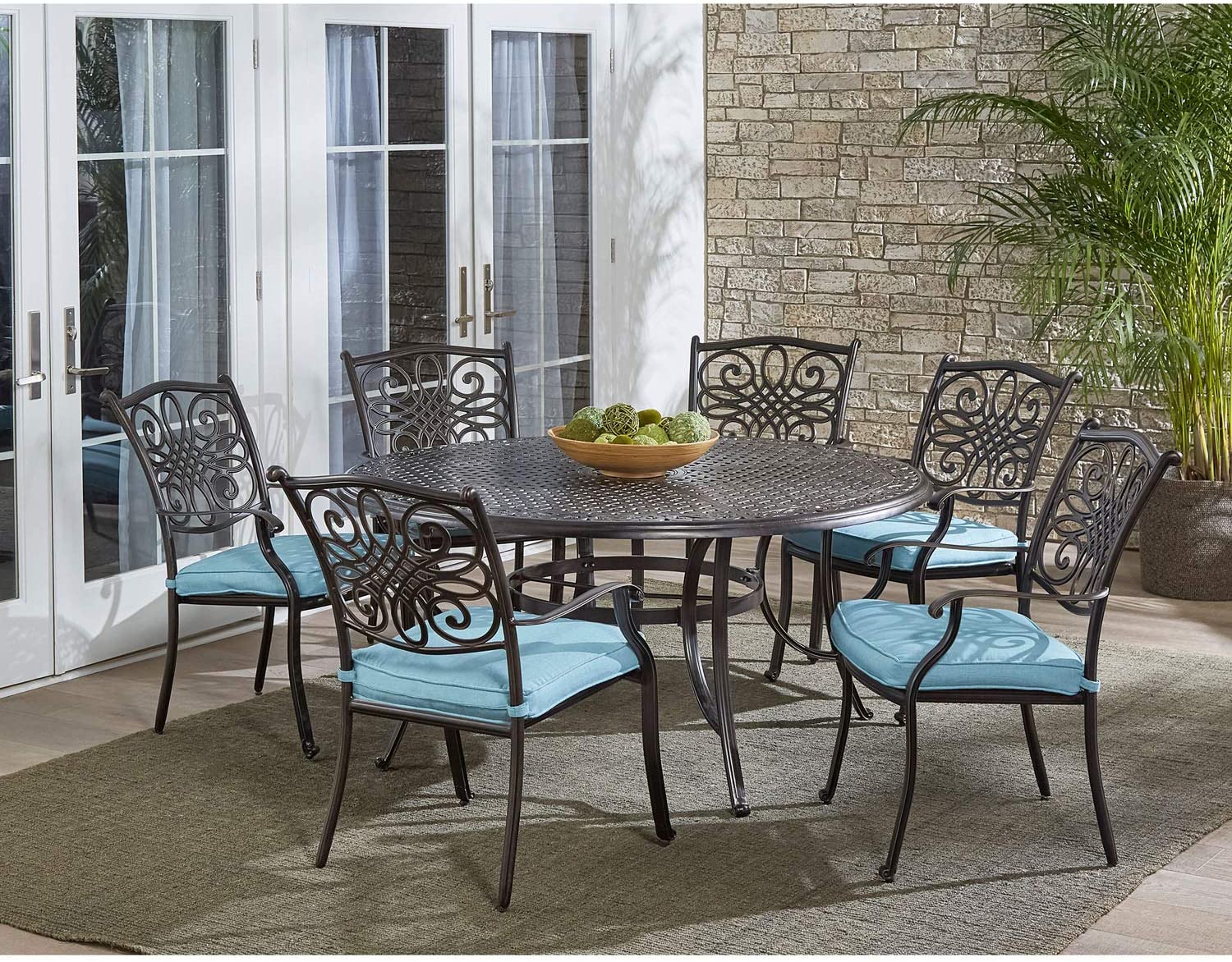 Hanover 7-Piece Tan with a 60 Cast-top Six Traditions Rust-Free Outdoor Patio Set Cushions, 6 Swivel Rockers and Aluminum Round Dining Table